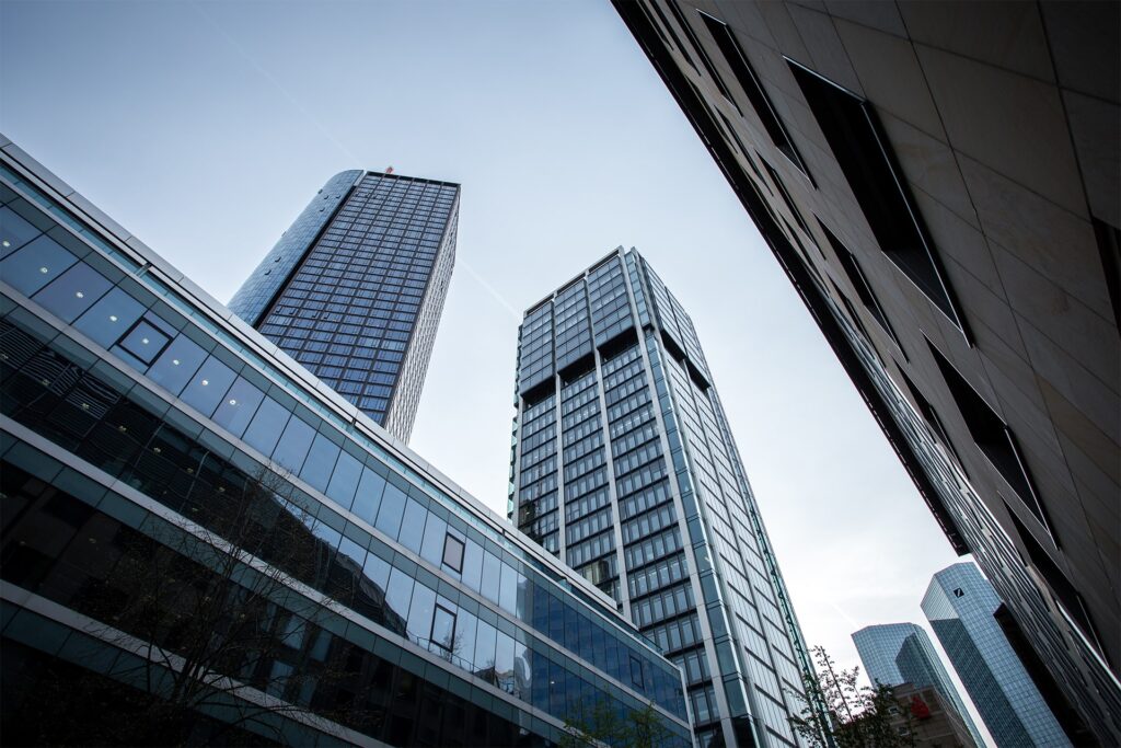low-angle-shot-high-rise-buildings-clear-sky-frankfurt-germany